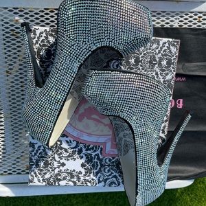 Bordello black iridescent platform pumps